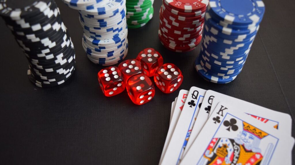 Casino chips, dice and cards representing free spins casino offers