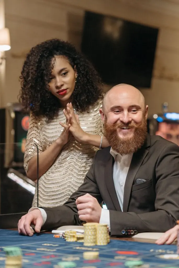 A woman and man at a casino table representing different casino audience branding