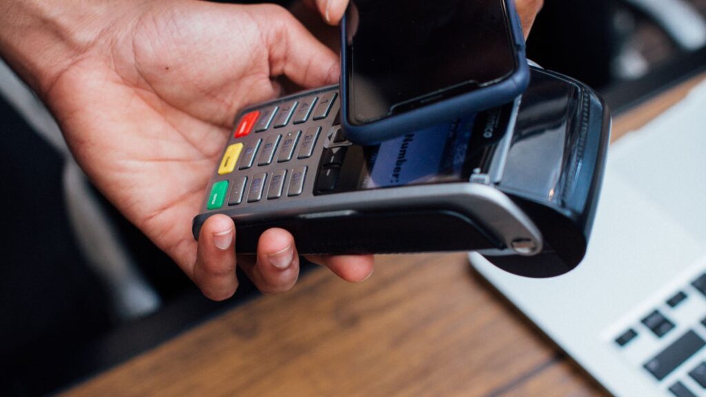 Customer making a contactless smartphone payment