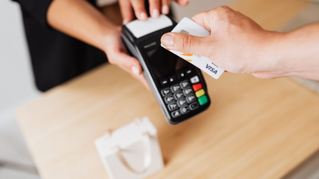 Visa card at a payment terminal representing Visa casino payments